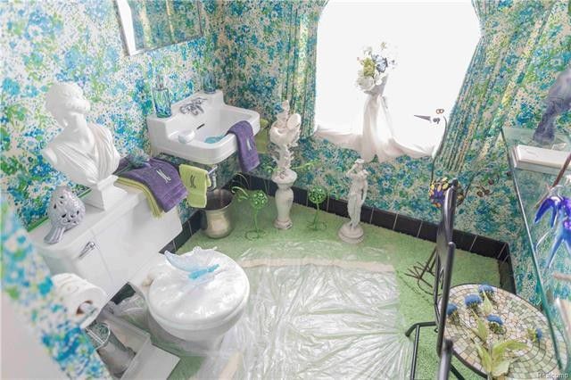 Bathroom with carpet covered with plastic