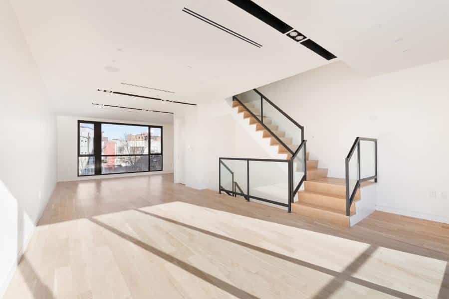 spacious white room with stairs