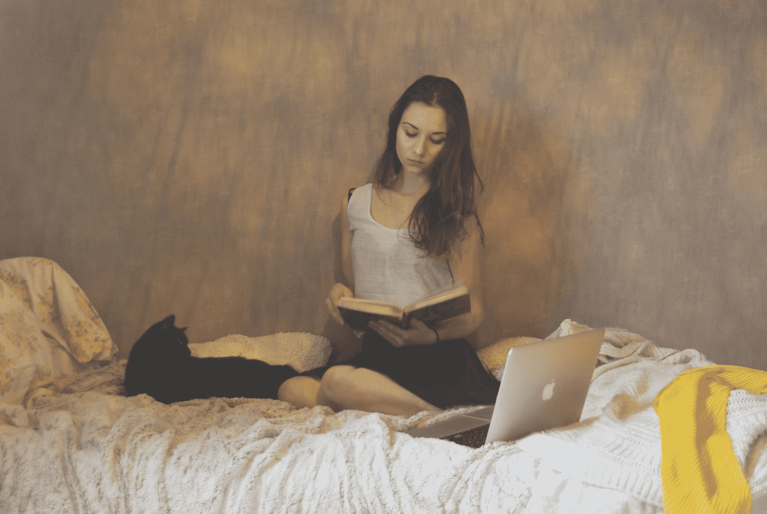 Woman studying in her bed
