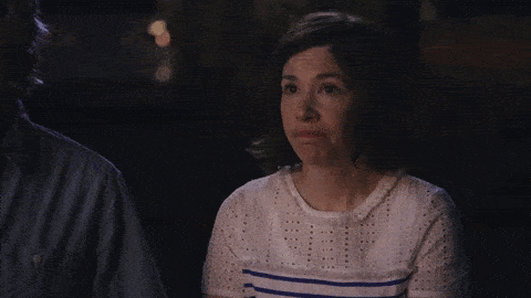 gif of Carrie Brownstein from the show Portlandia giving a slight shrug of her shoulders as if to say ok, that's kind of funny.