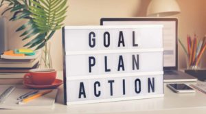 Goal,plan,action text on light box on desk table in home office.Business motivation or inspiration,performance of human concepts ideas