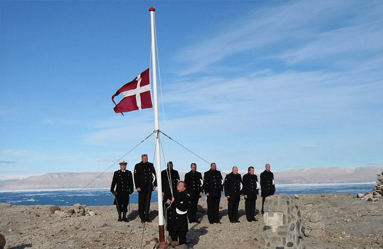 Denmark naval officers visit the island and leave a Danish flag