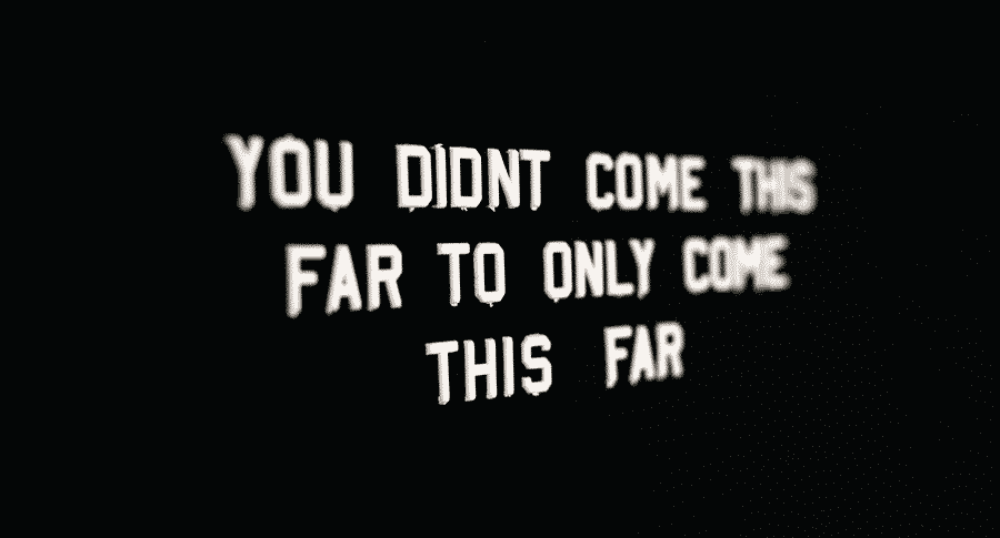 A quote on a board that reads: You didn't come this far to only come this far