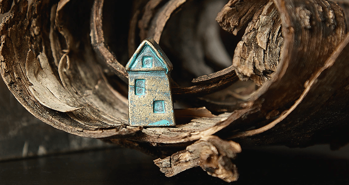 A small wishing house made of pewter