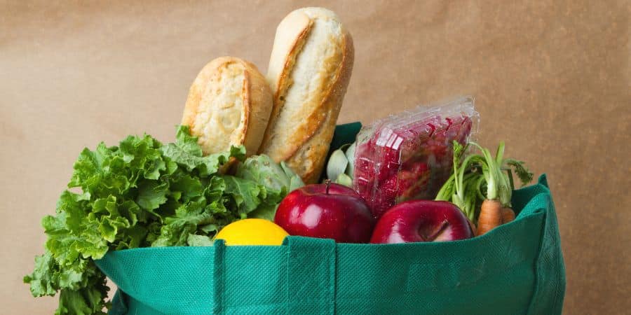 Grocery Bag with Bread, apples, strawberry carrot, lemon and lettuce