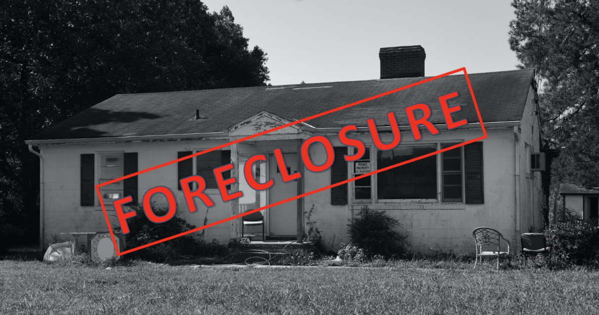 black and white photo of rambler home with red foreclosure stamp over it, illustrating one stage of the real estate market cycle