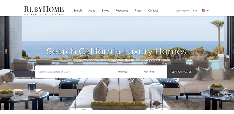 real estate website example with an image of a sleek modern home overlooking the ocean