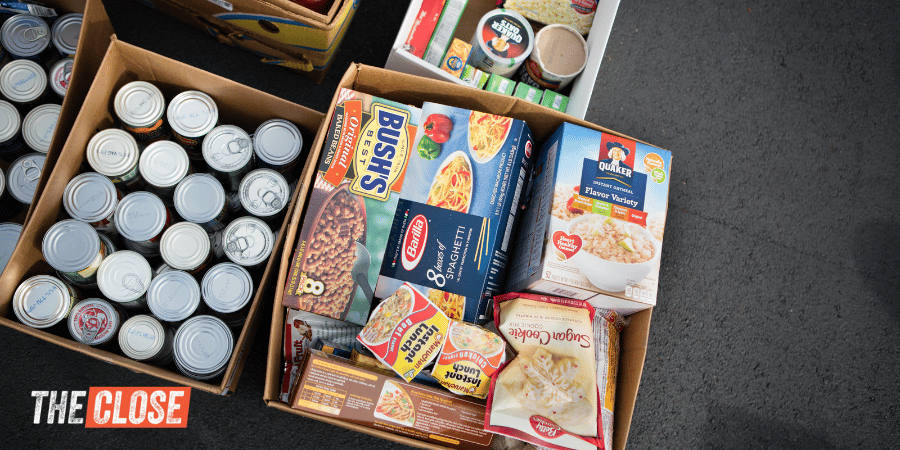 some canned goods and non-perishable food items collected in some boxes.