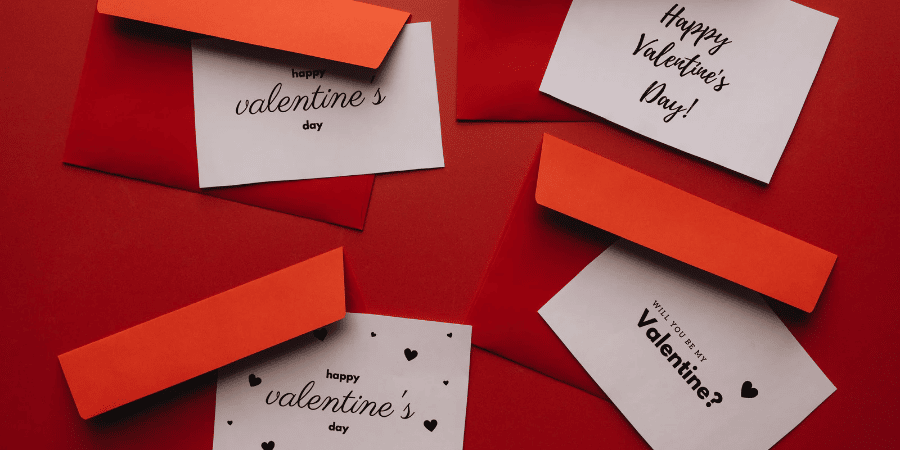 several Valentine's Day cards and envelopes to send to real estate clients