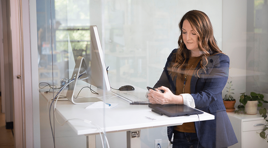 Photo of Realtor sending open house follow-up emails on her phone