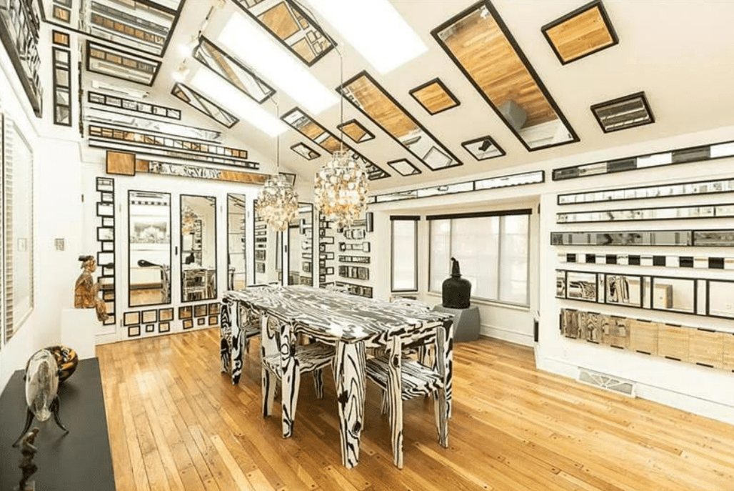 a dining room with an absurd number of mirrors on the ceiling