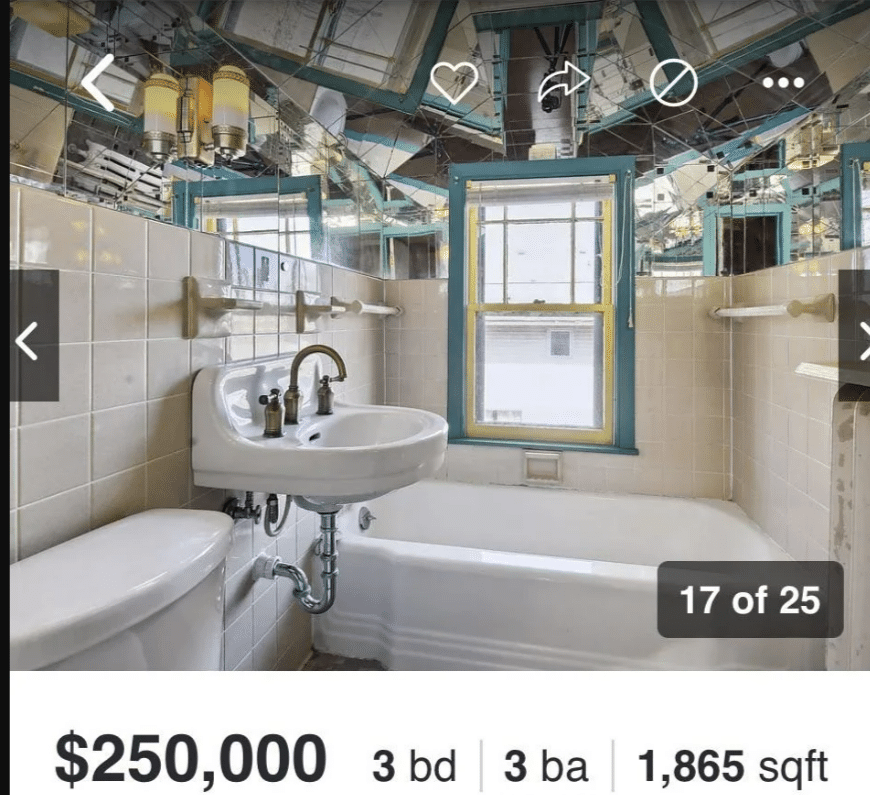 a bathroom with an absurd number of mirrors on the ceiling