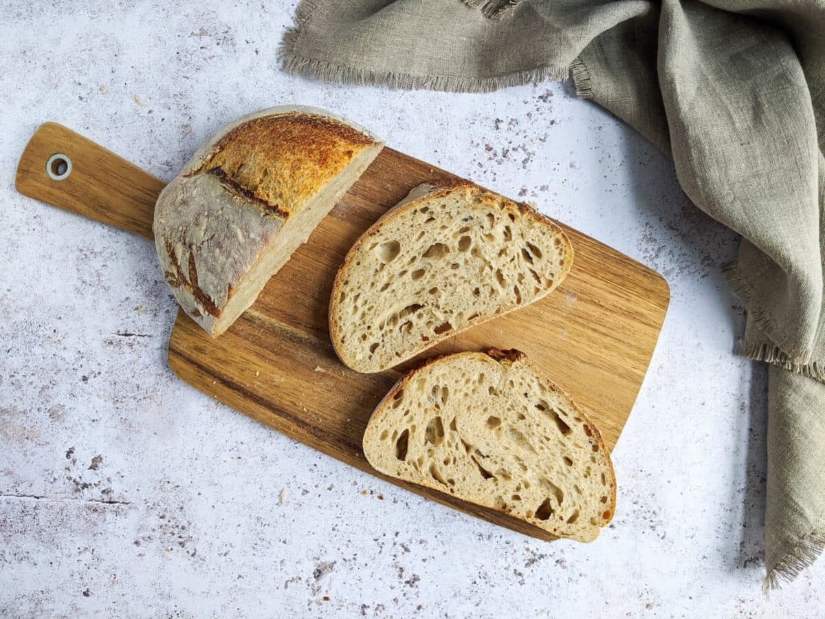 a rustic cutting board with freshly baked bread.