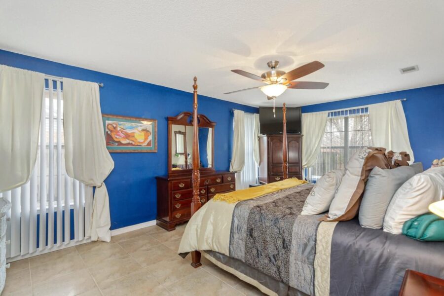 This primary bedroom was painted bright blue.