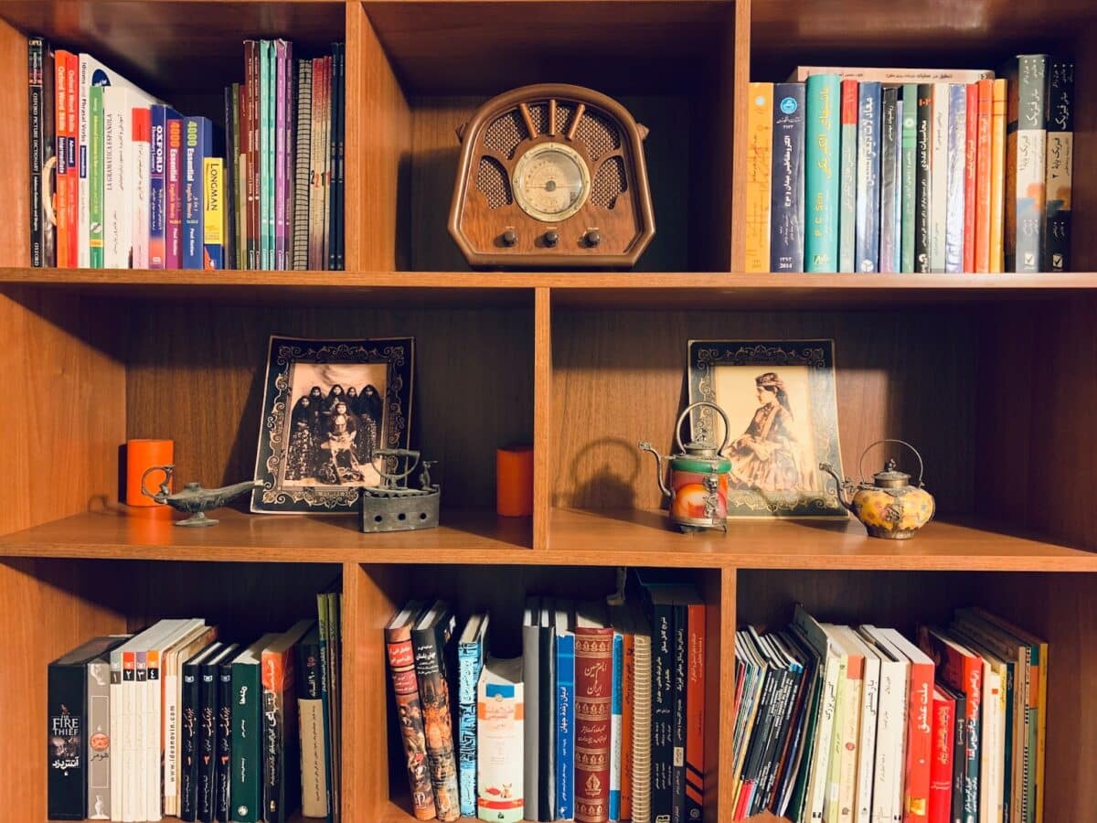 Break up big chunks of books with knick knacks and decor pieces when staging bookcases in a home