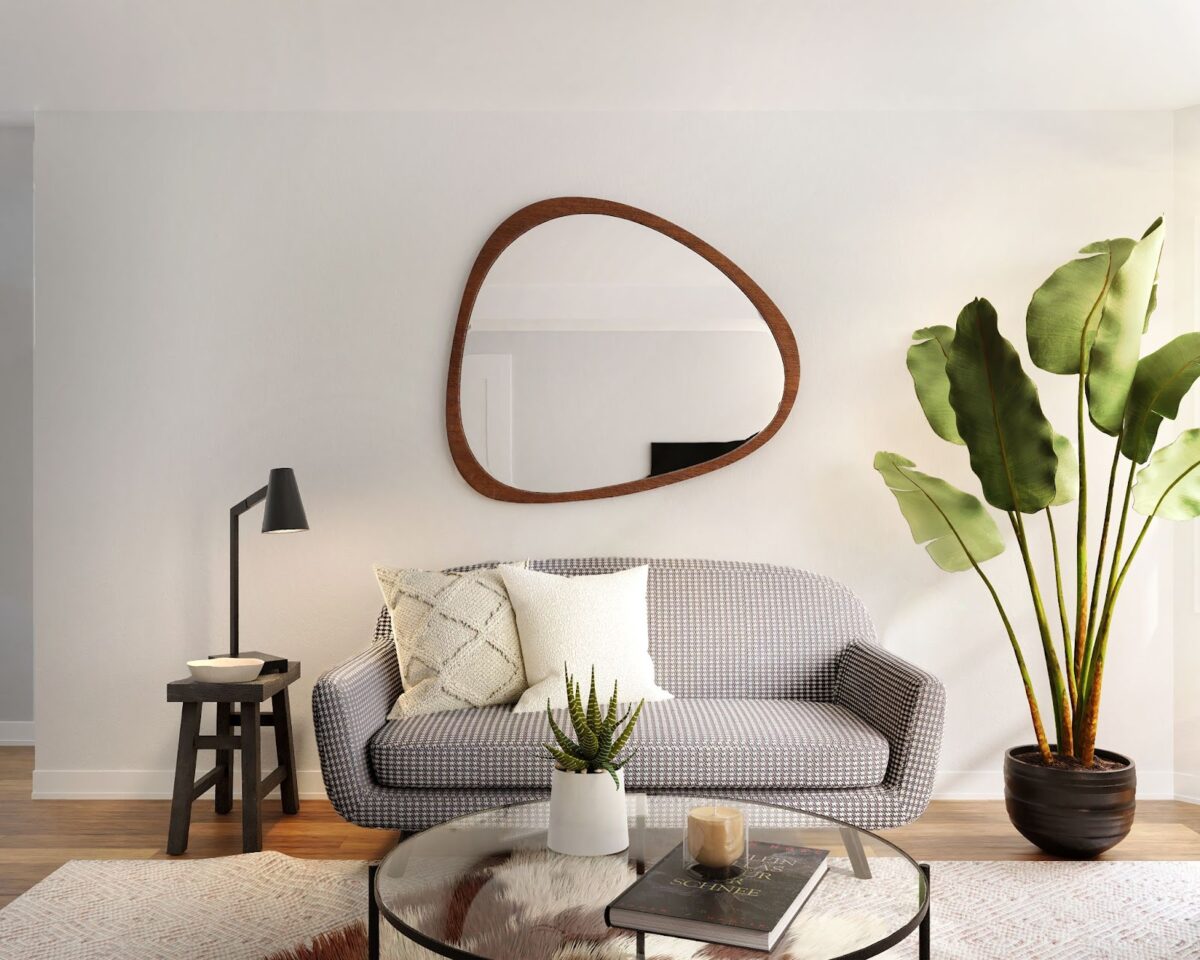 In home staging, mirrors add depth and complexity to spaces like in this living room setting