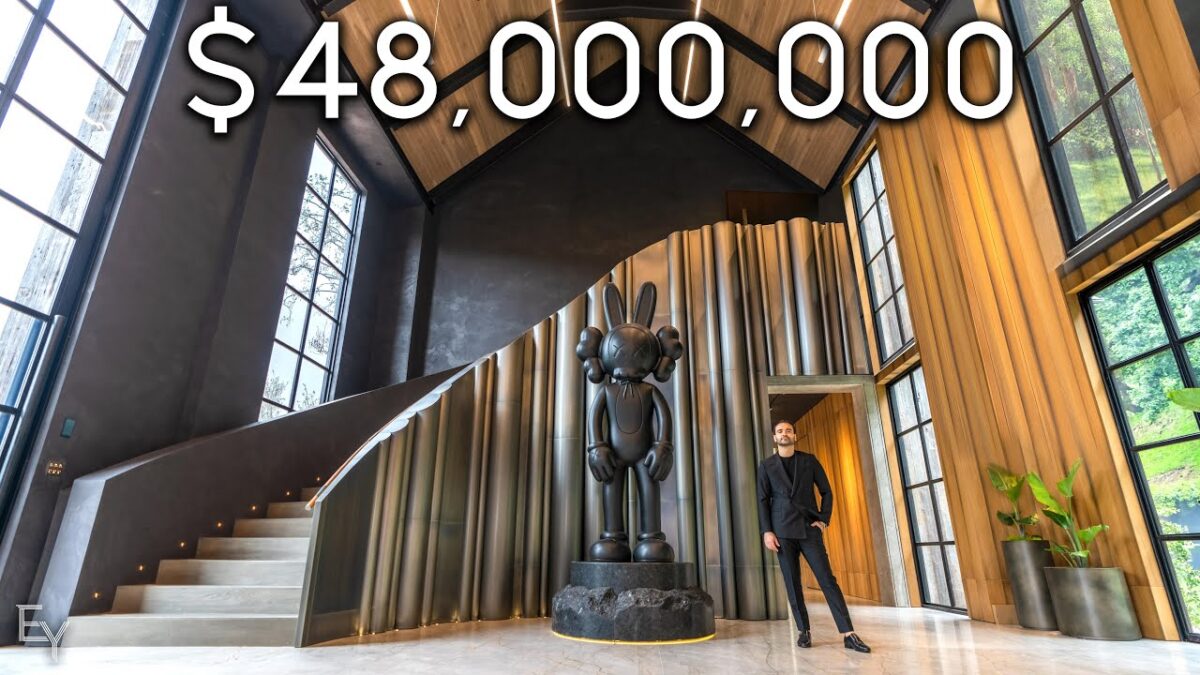 Enes Yilmazer YouTube Channel; Enes standing in front of a modern staircase with a sculpture, caption "$48,000,000"