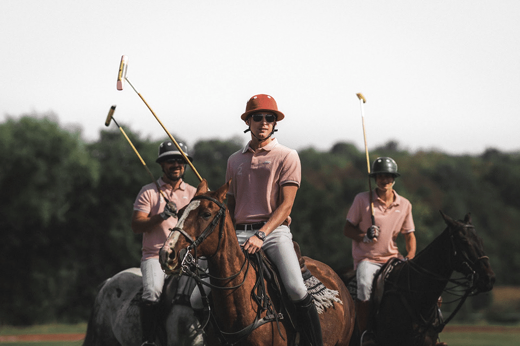 group of polo players on horseback