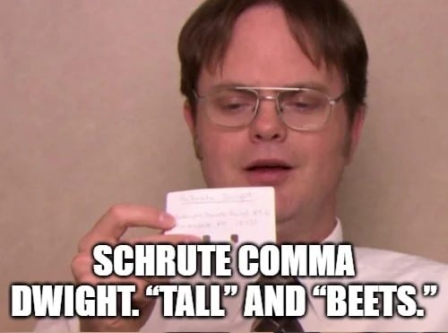 Dwight Schrute from The Office holding rolodex card with "tall" and "beets" written on it.