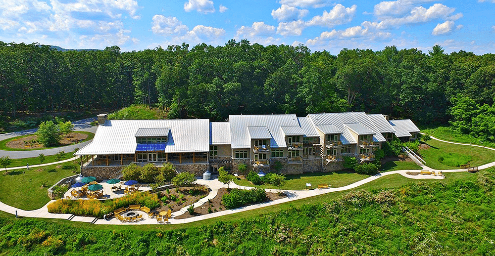 An eco-lodge in Pennsylvania, The Nature Inn at Bald Eagle, surrounded by trees and beautiful landscape