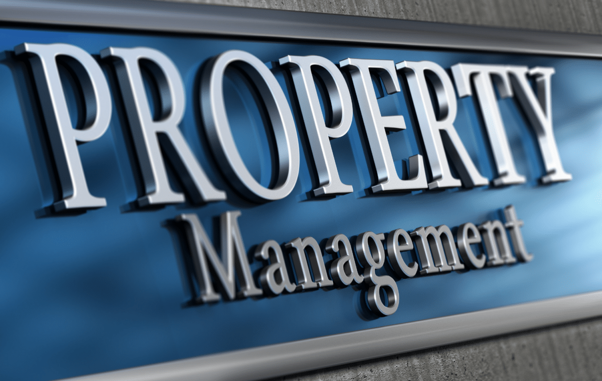 A blue and silver sign that says Property Management