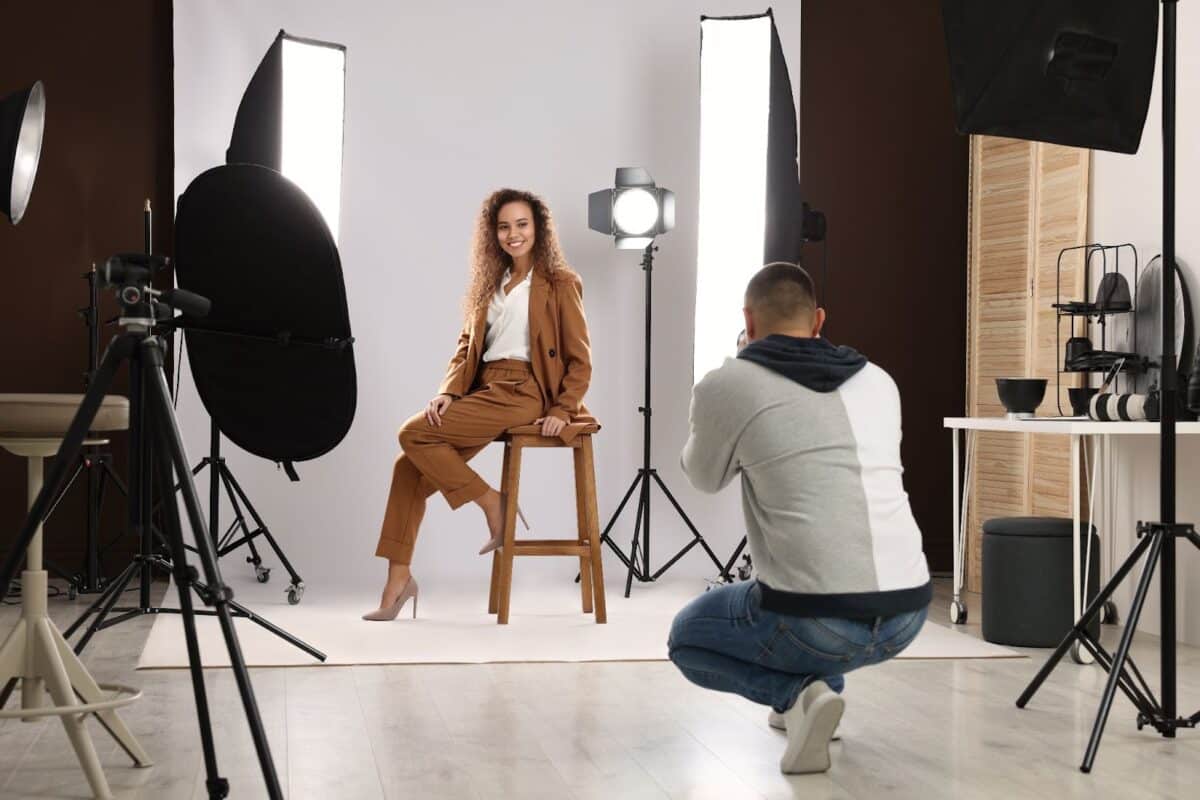 An employee posing for a professional photographer in a studio