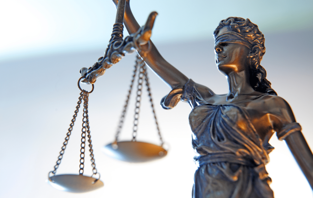 Image of Lady Justice holding her scales