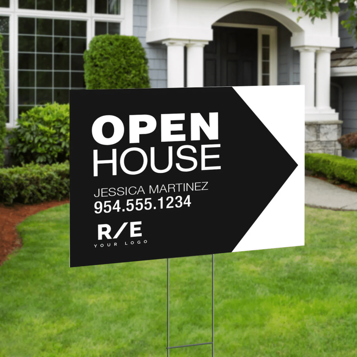 A black and white, minimalist real estate sign with an arrow