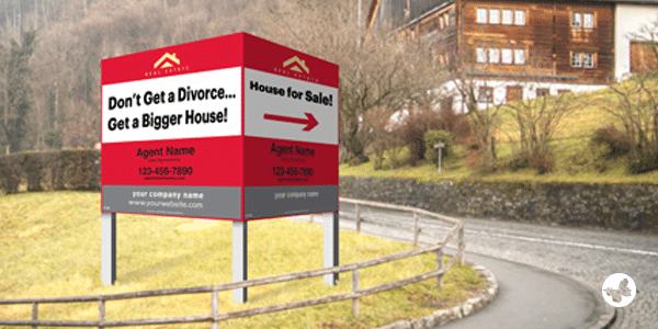A red real estate sign that says, "Don't get a divorce... get a bigger house!"