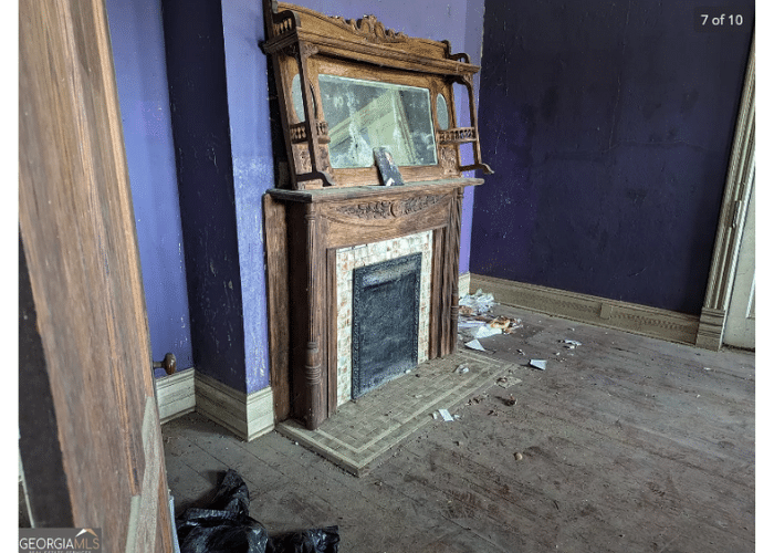Abandoned fireplace in a creepy real estate listing